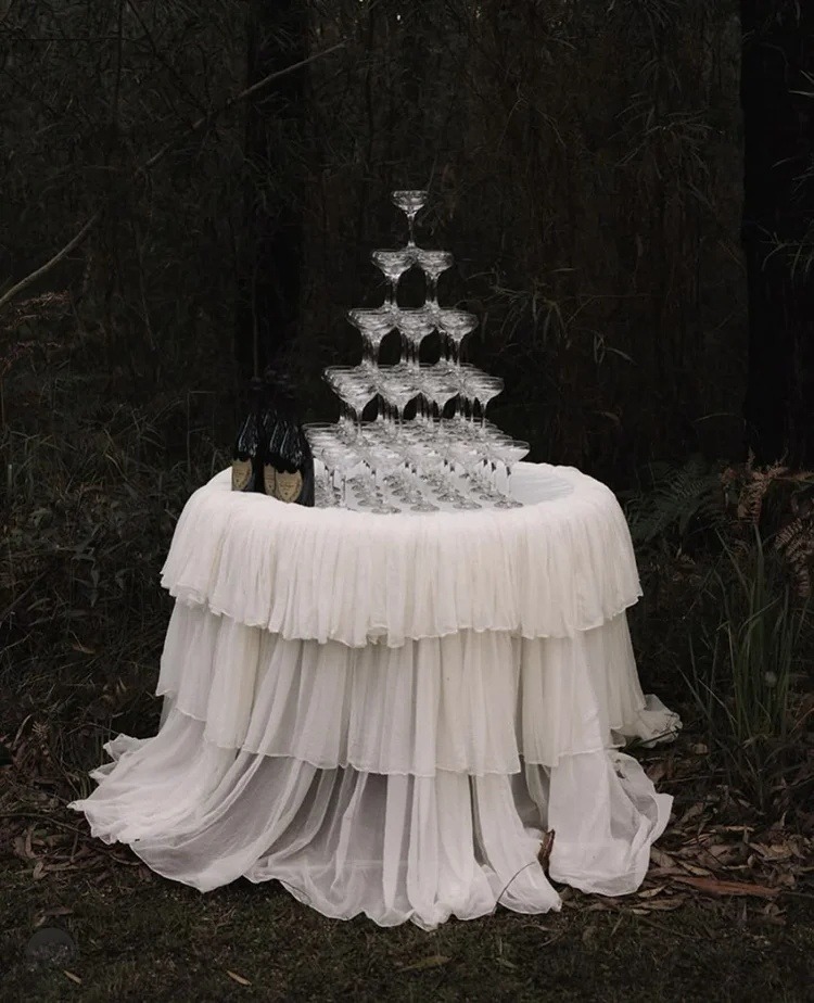 Champagne tower with forest backdrop
